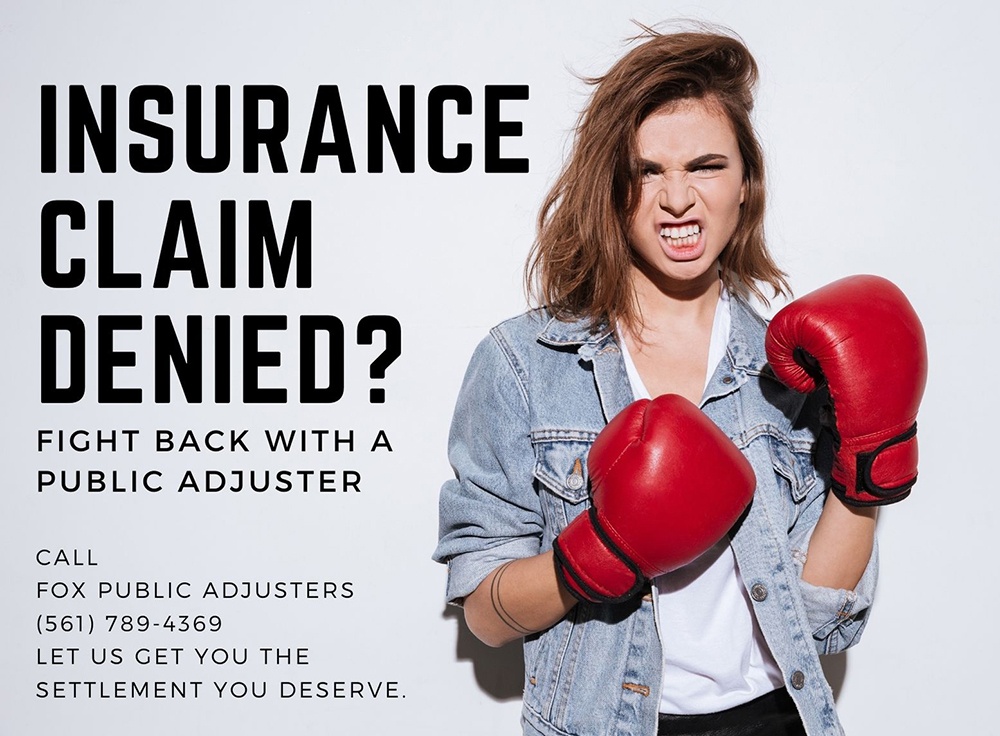 Homeowner with a denied insurance claim wearing boxing gloves