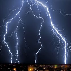 Lightening over the landscape in the summer night.